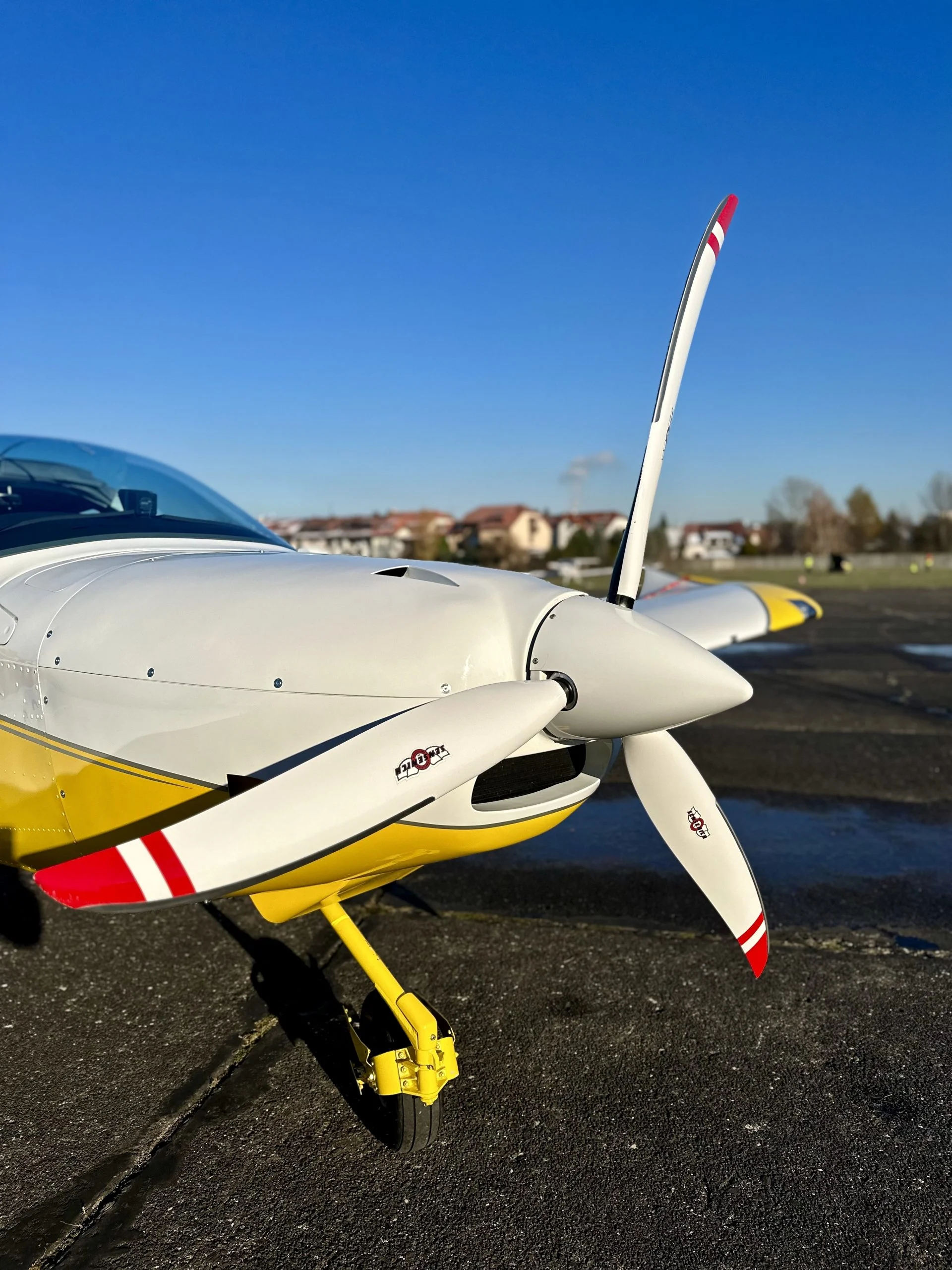 Close-up of a Ventum Air training aircraft propeller at the airfield